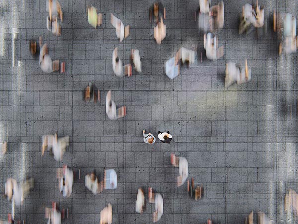 an aerial view of people walking
