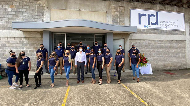 Employees in front of the RRD building in Costa Rica wearing masks
