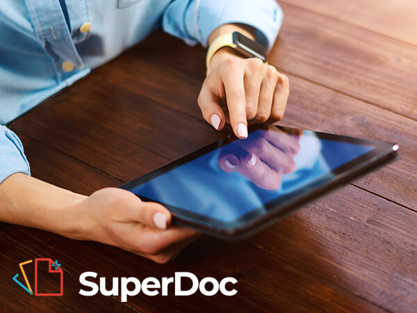 SuperDoc logo overlaying an image of someone using a tablet