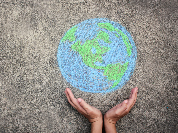 Chalkboard drawing of the world on the sidewalk