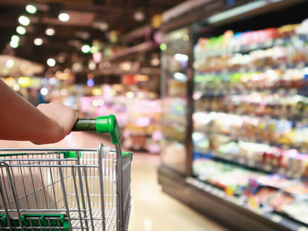 cart being pushed through a grocery store