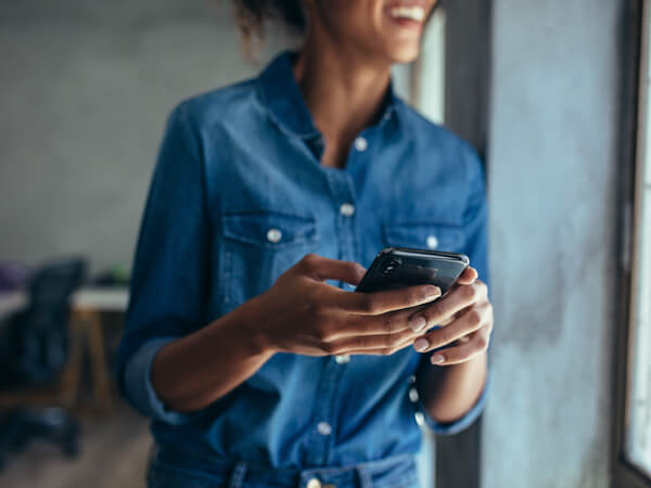 Businesswoman with mobile phone in hand