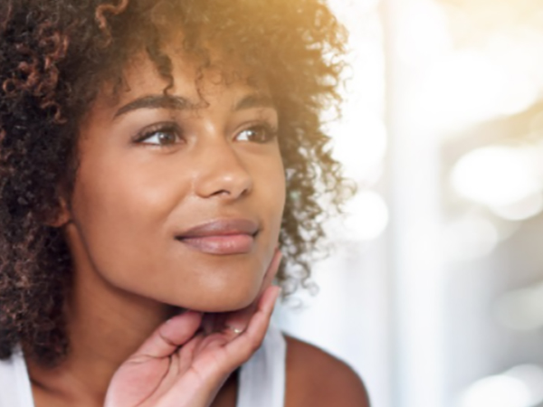 woman looking at herself in the mirror