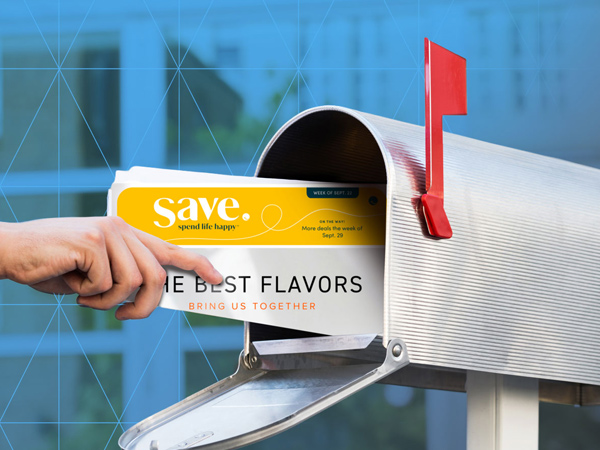 Hand reach in mailbox and pulling out a mailer