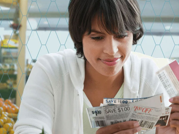 woman looking through coupons