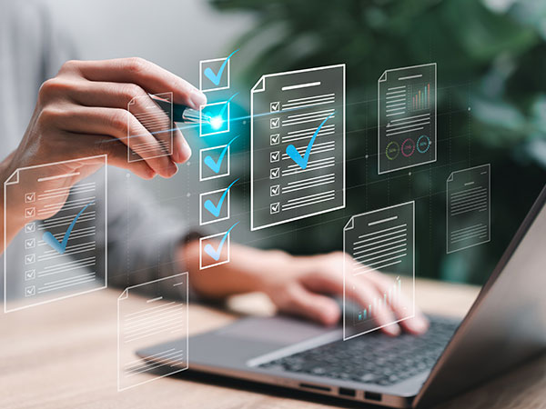 digital graphics floating infront of a laptop