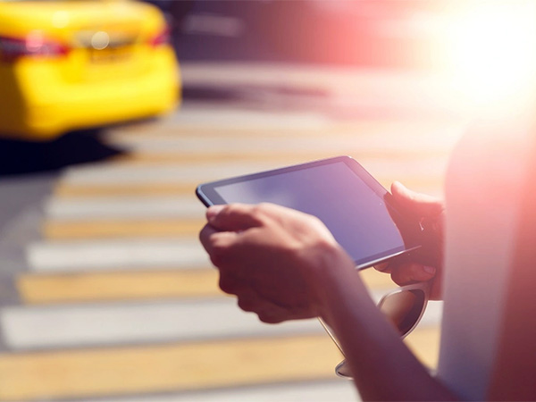Female hands closeup holding sunglasses and tablet