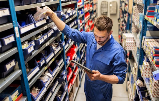 auto mechanic or smith with tablet pc at workshop