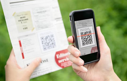 smart phone scanning a QR code