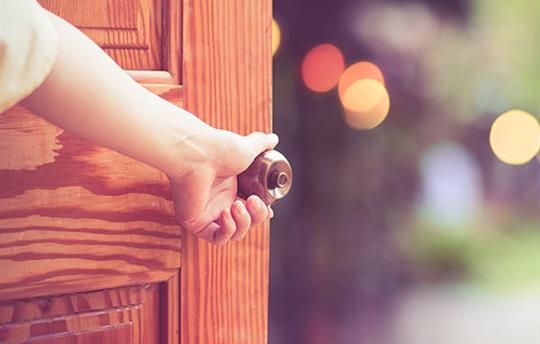A misty mountain range at sunrise