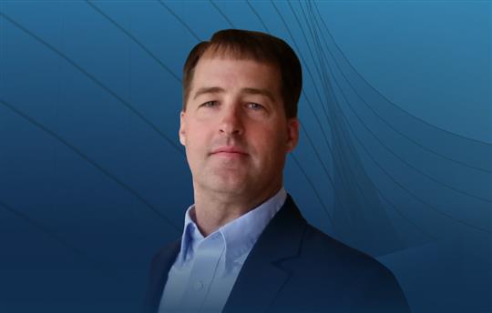 Brian Cox on blue background