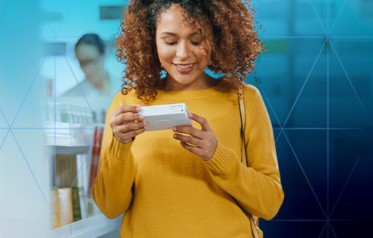 Woman reading a pharmaceutical package