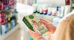 consumer holding a box of granola