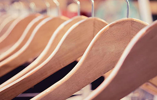 row of wooden clothing hangers